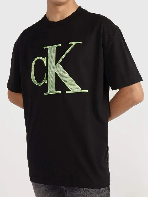 Calvin Klein crna muška majica sa zelenim slovima