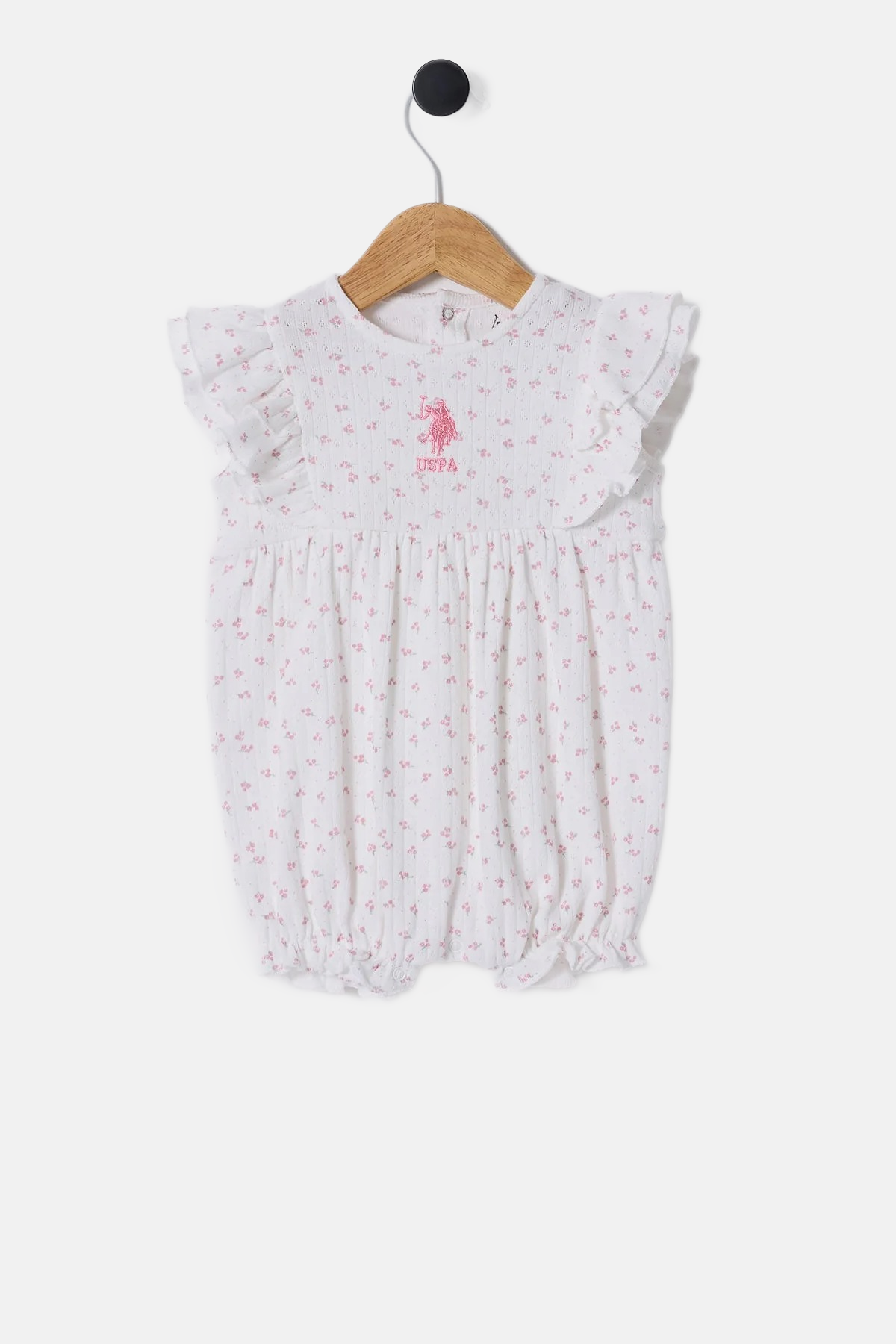 U.S. Polo Assn. bijeli kombinezon za bebe s volanima i cvjetnim uzorkom