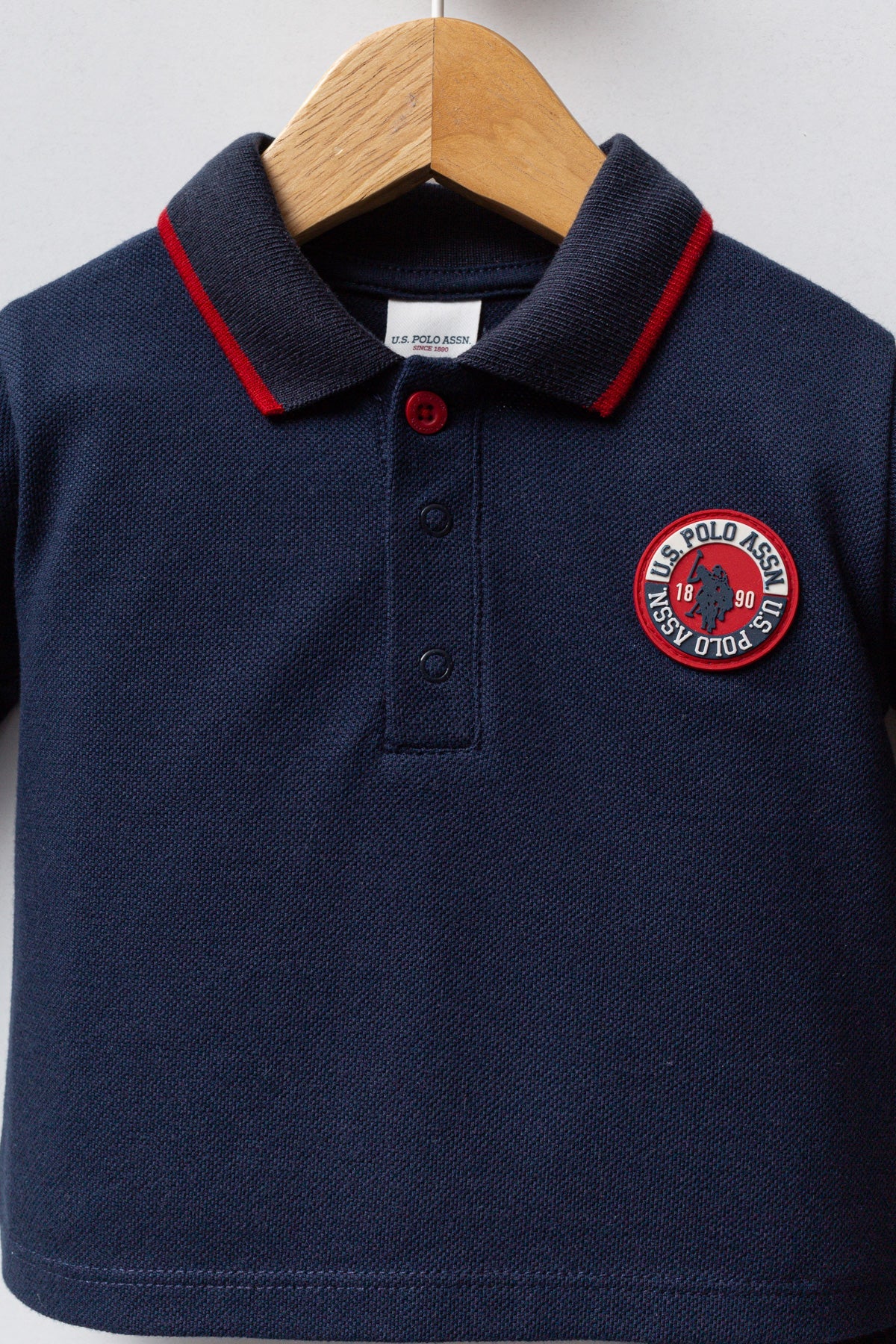 U.S. Polo Assn. teget plava trenerka za dječake s polo kragnom i okruglom oznakom