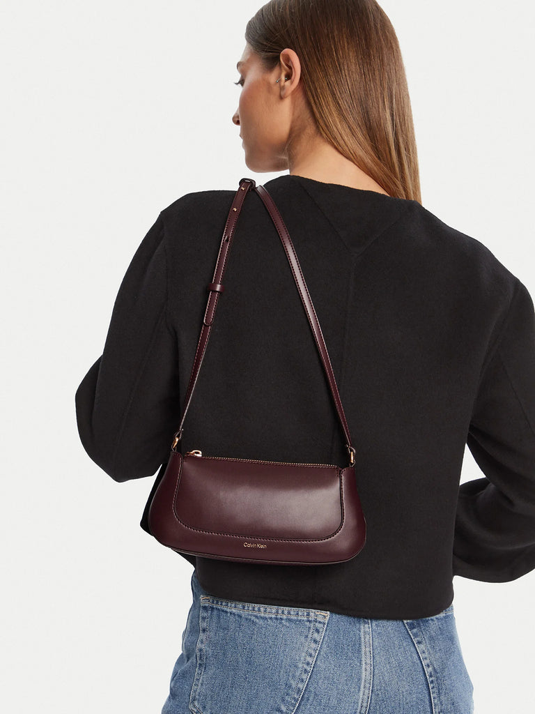 Calvin Klein bordo ženska torba sa zlatnim detaljima-[SKU]