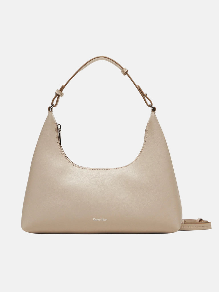 Calvin Klein bež ženska torba sa diskretnim logom-[SKU]