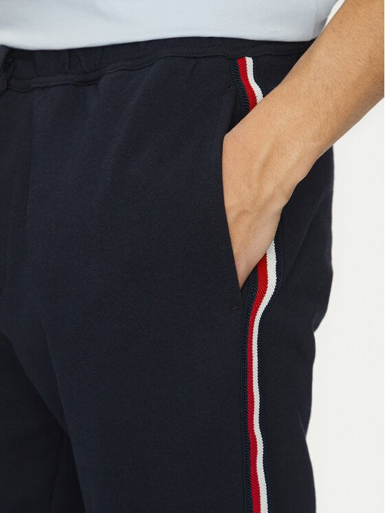 Tommy Hilfiger tamnoplava muška trenerka s bočnom prugom